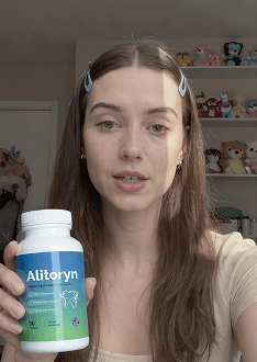 Julia holding a bottle of Alitoryn