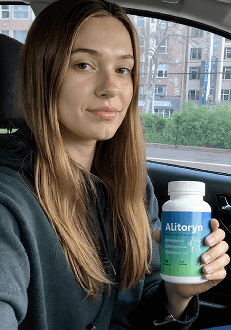 Carlos holding a bottle of Alitoryn